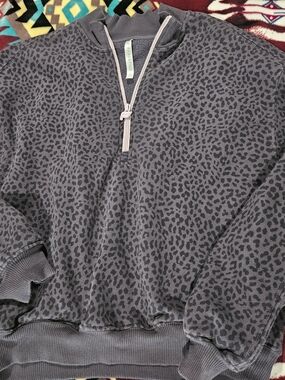 Fabletics Quarter-Zip Leopard Print Pullover in Charcoal